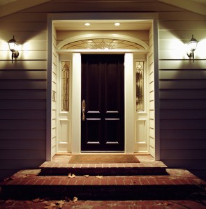 Front door of house with lights at night